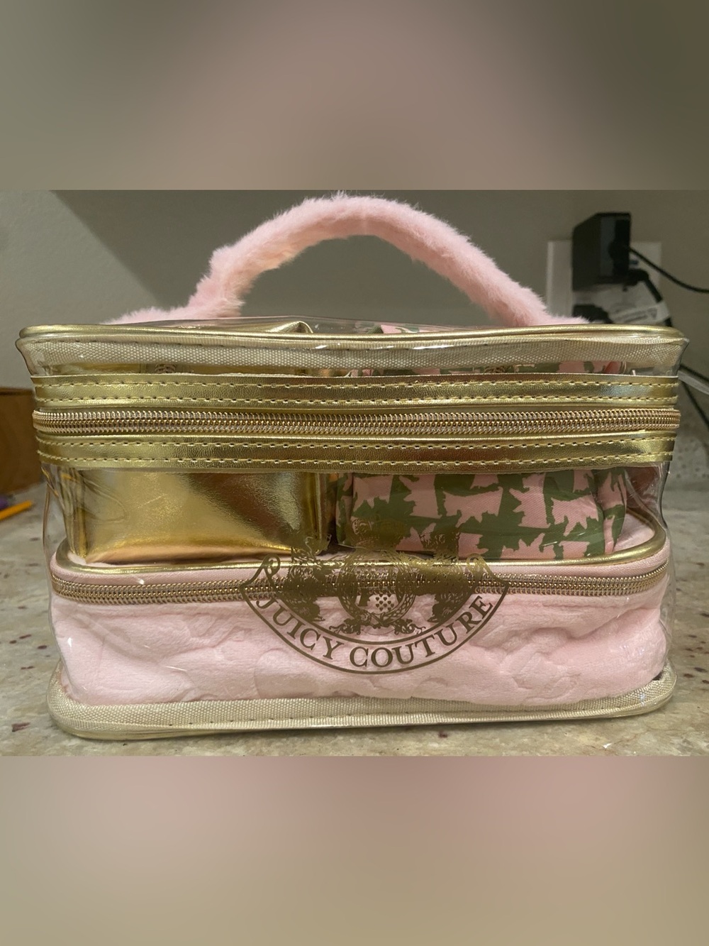 4 piece Juicy Couture Pink and Gold Quilted Cosmetic Carry Case.